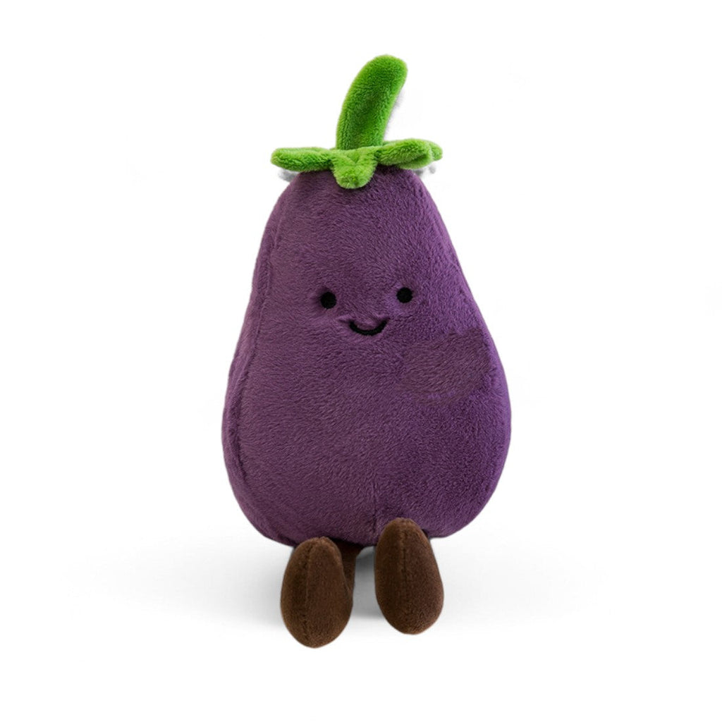 Kuscheltier in Kawaii-Optik, eine violette lächelnde Aubergine mit grünen Blättern und kleinen braunen Beinen, auf weißem Hintergrund.