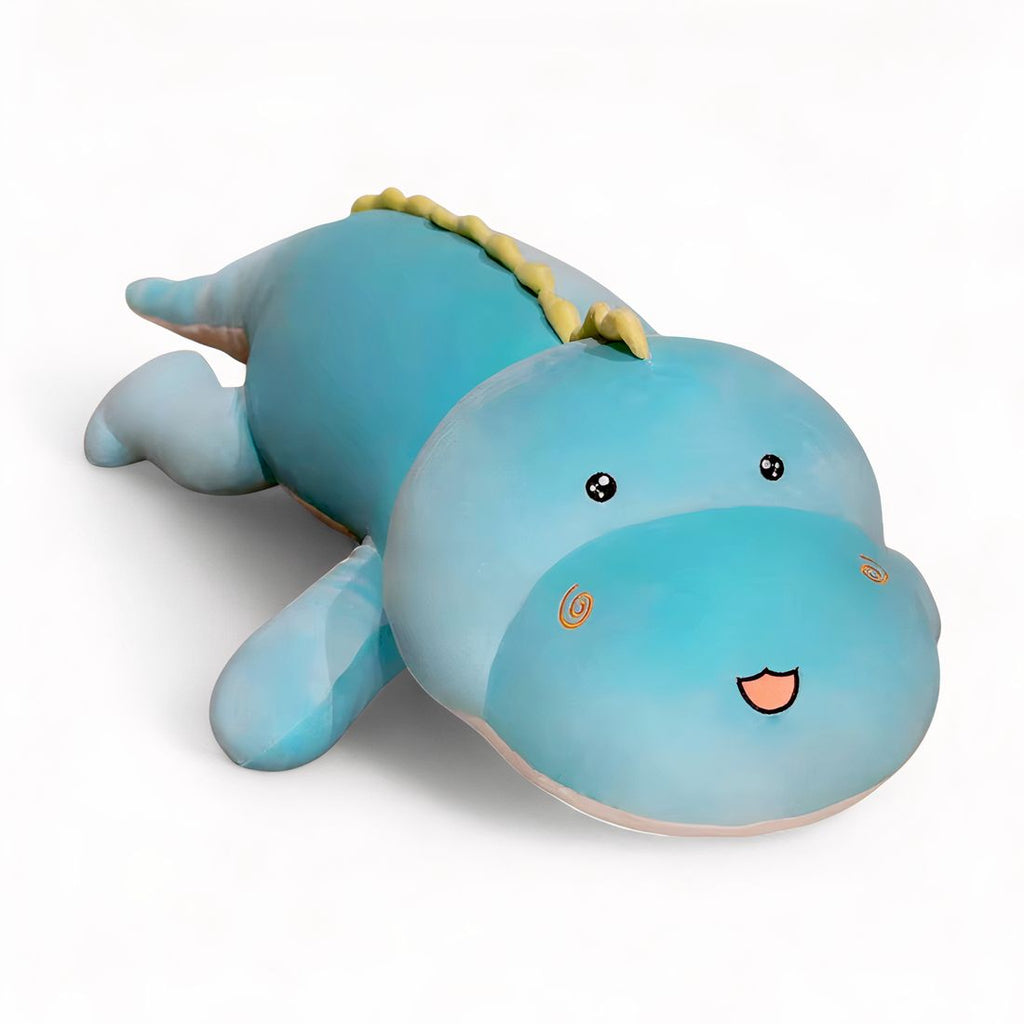 XXL Dinosaurier-Kuscheltier, pastellblaue Farbe, liegend auf weißem Hintergrund.