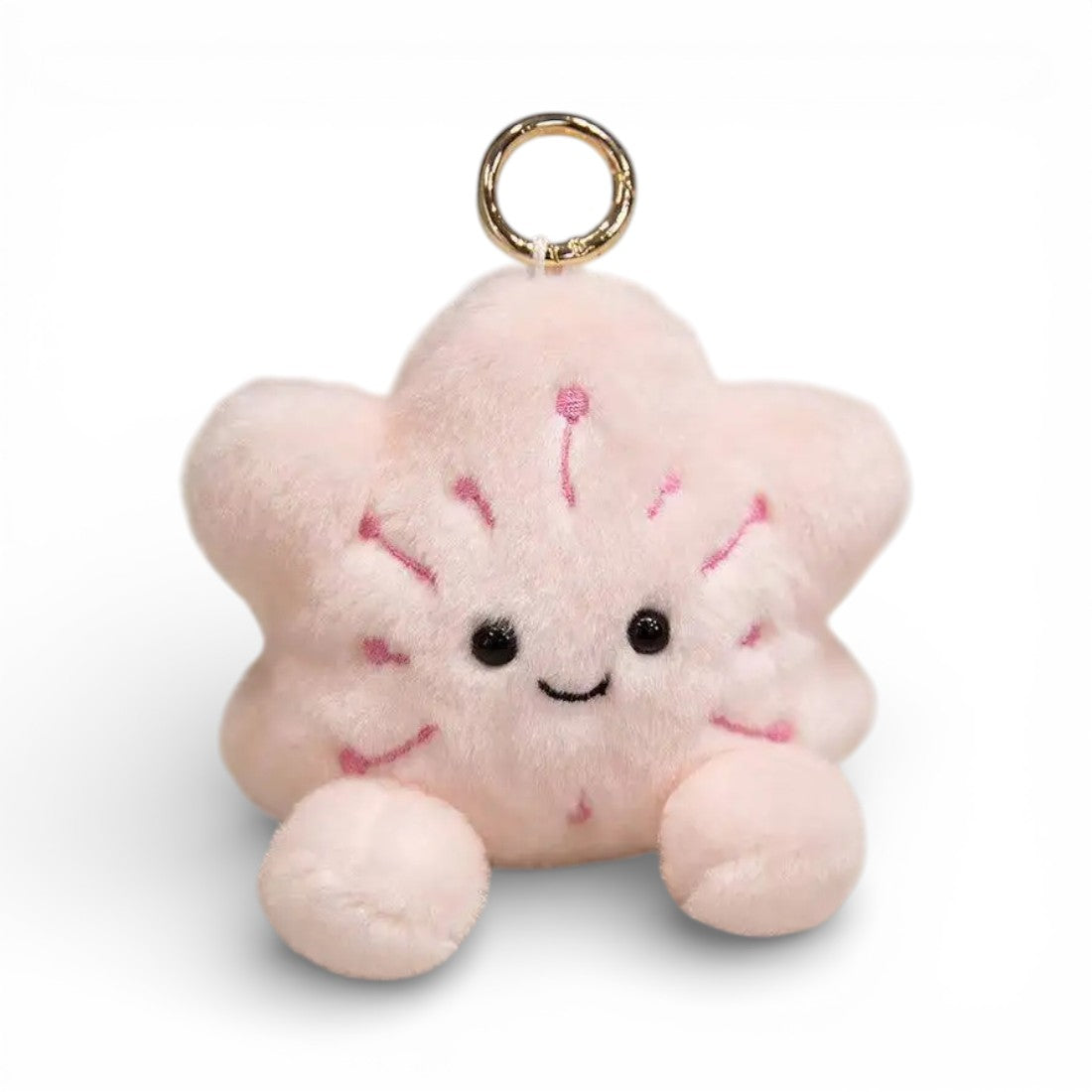 Rosafarbenes Kuscheltier in Sternform kawaii, 12 cm, mit großen glänzenden schwarzen Augen, fröhlichem Lächeln, fünf flauschigen Zacken, zwei kleinen runden Pfötchen unten und einem goldenen Ring als Schlüsselanhänger, auf weißem Hintergrund.