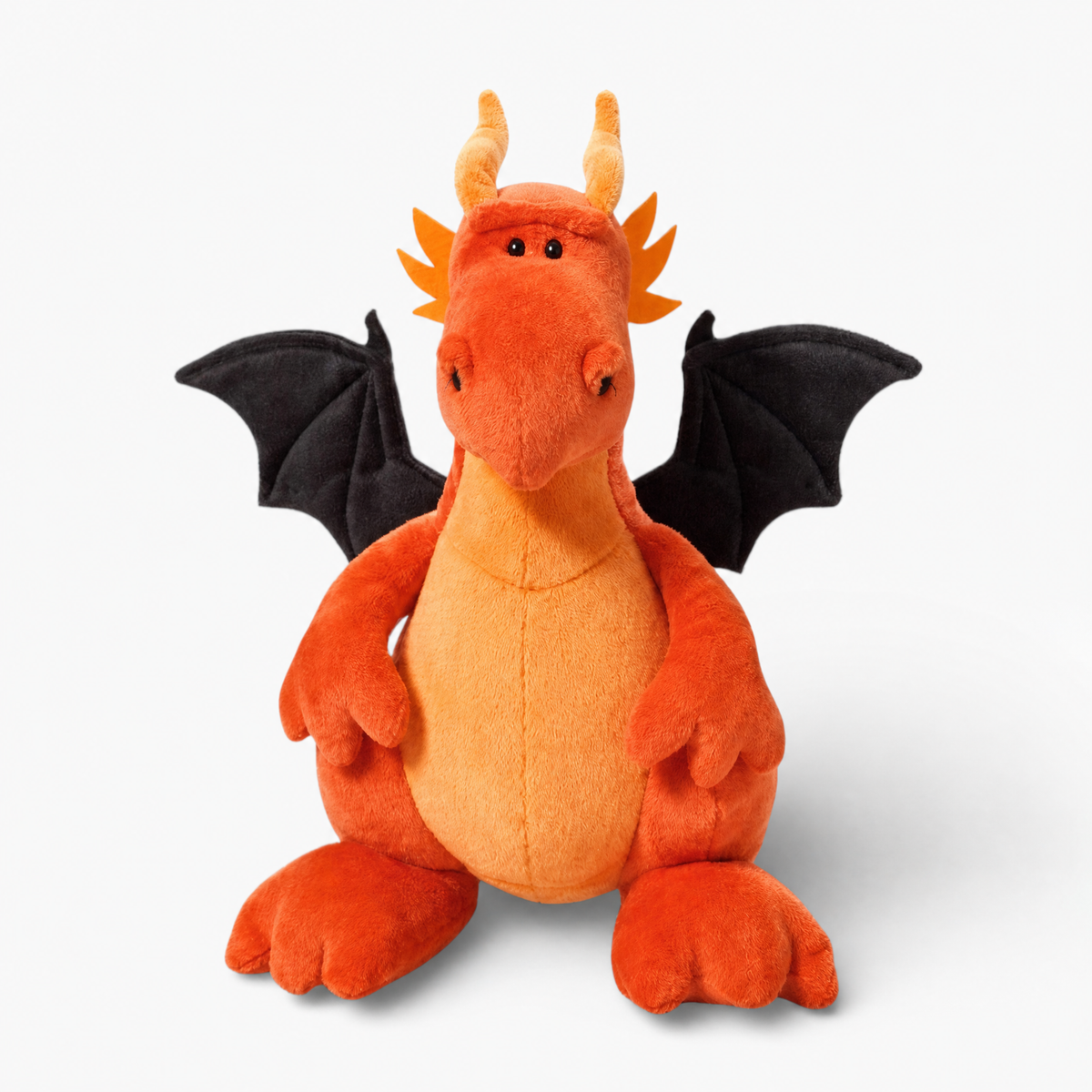 Orangefarbenes Drachen-Kuscheltier mit schwarzen Flügeln - Weißer Hintergrund frontal