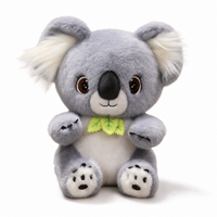 Graues Koala Kuscheltier mit Eukalyptusblatt - weißer Hintergrund Frontal